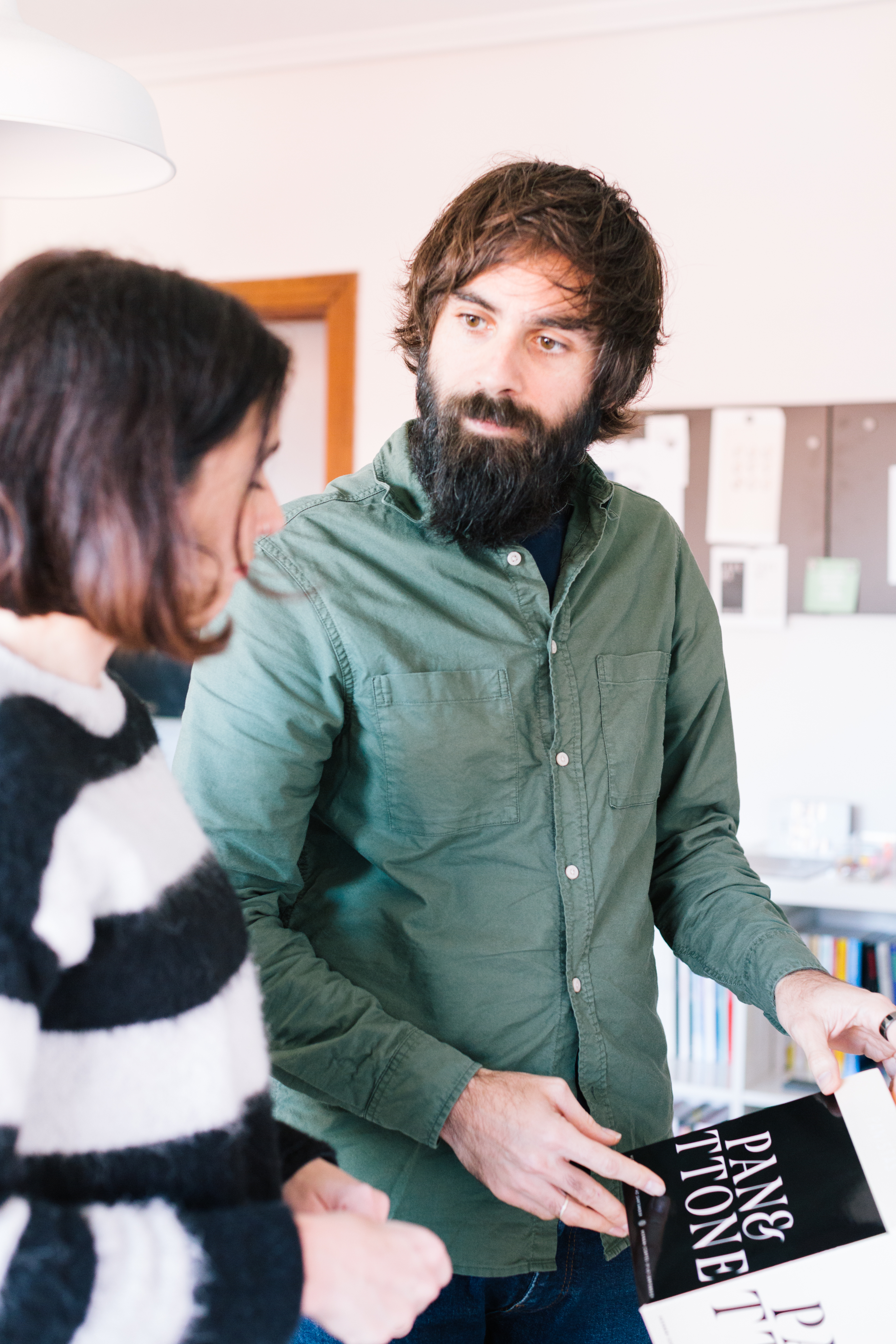 A render of three white cylindrical columns, against a warm creme background